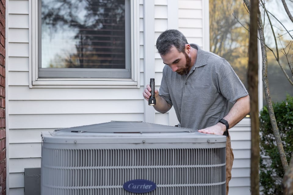 HVAC technician servicing a commercial system